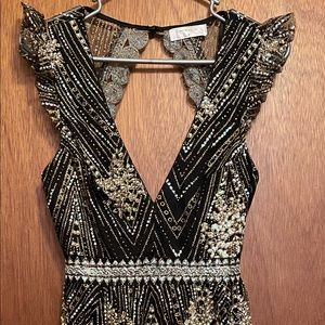 Hello Molly size 6/M black dress with colorful glitter embellishments.